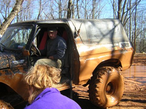 1979 Ford Bronco - Muddy 1978 Ford Bronco with driver visible, parked in a muddy off-road area. ARB logo is on the side.