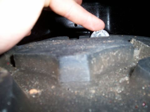 1974 Ford F-100 - A quarter is placed in the tire tread to demonstrate its depth.