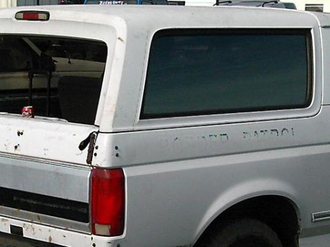 1986 Ford Bronco - White Ford Bronco, likely from the late 1980s, with 'PATROL' text visible on its side.