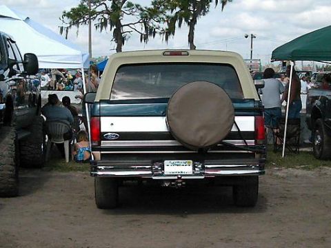 1986 Ford Bronco - This 1986 Ford Bronco is seen from the rear, a spare tire mounted on the tailgate and a two-tone paint scheme.
