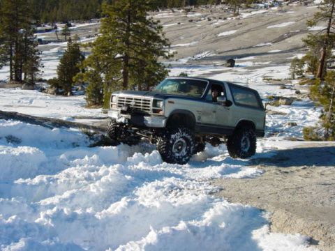1986 Ford Bronco - This 1986 Ford Bronco navigates a snowy terrain, its off-road capabilities.