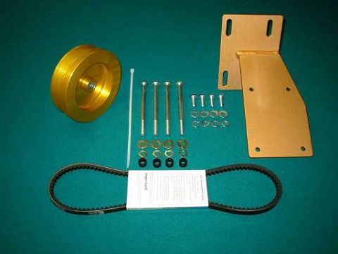 1993 Ford Bronco - York onboard-air compressor mounting kit laid out on green felt: gold zinc-plated multi-groove pulley and slotted L-shaped mounting bracket…