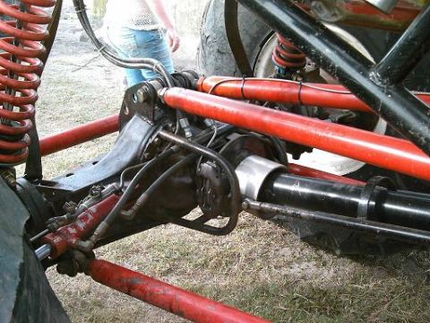 1986 Ford Bronco - Custom suspension and steering components on a modified off-road vehicle are visible.