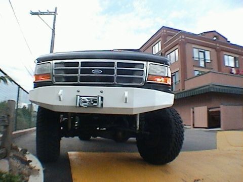 1993 Ford Bronco - Front view of a 1993 Ford Bronco a custom winch bumper and grille.