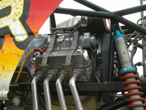 1986 Ford Bronco - Close-up view of the engine and suspension system of a modified vehicle, likely for racing or off-road use.