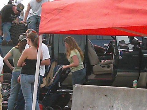 1986 Ford Bronco - A truck's interior is visible with people standing nearby.