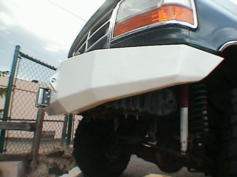 1993 Ford Bronco - Custom bumper on a vehicle, likely from the early to mid-1990s, with a visible grille and headlight.