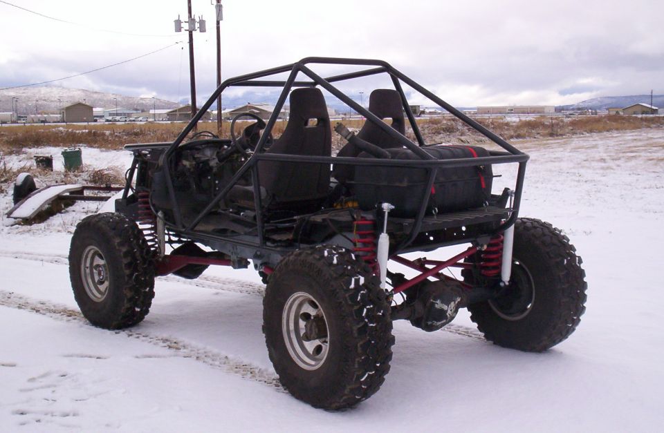 custom buggy with roll cage and large tires in snow