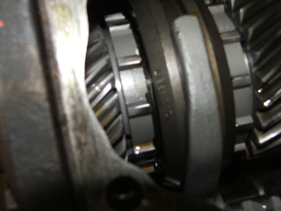 Close-up of transmission gears with visible part numbers