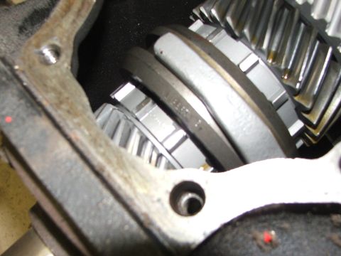 1965 Ford Mustang - Internal view of a transmission showing meshing gears and housing components.