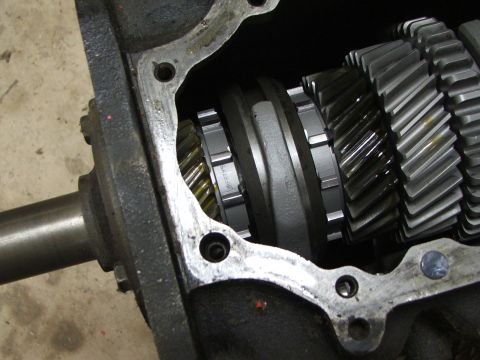 1965 Ford Mustang - Internal view of transmission gears, showing the intricate teeth and synchro rings. Text 'SPRTYN' is visible on one of the components.