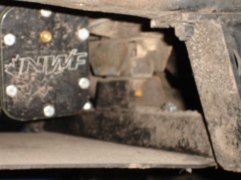 1989 Ford Bronco - Close-up of suspension components with an NWF logo plate visible.