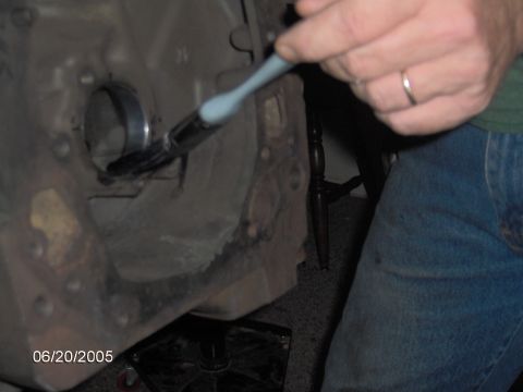 1978 Ford Bronco - Someone is cleaning an engine block with a brush, date stamp reads 06/20/2005.