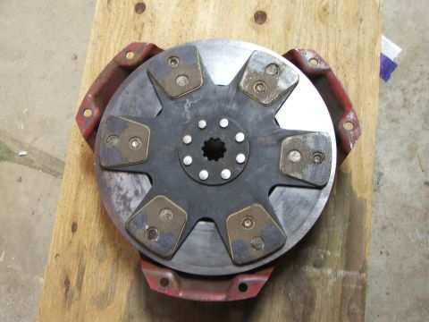 1965 Ford Mustang - Clutch disc and pressure plate assembly shown on a wooden background.