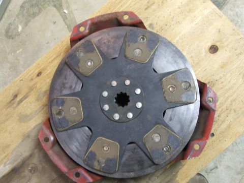 1965 Ford Mustang - A clutch disc assembly, likely for a manual transmission, is shown with its splined hub and friction pads.