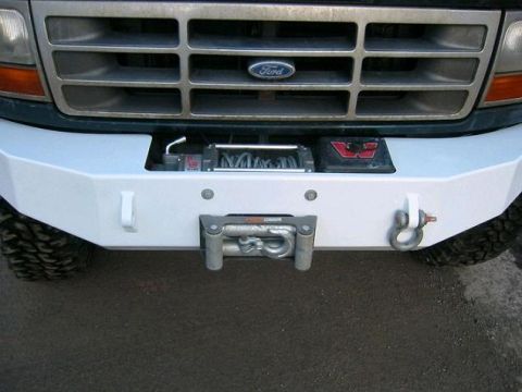 1993 Ford Bronco - Front view of a 1993 Ford Bronco's aftermarket bumper with a winch installed.