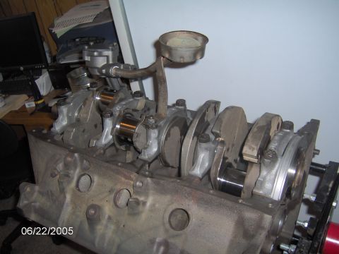 1978 Ford Bronco - This is a close-up view of an engine block assembly, showing the crankshaft and oil pickup.