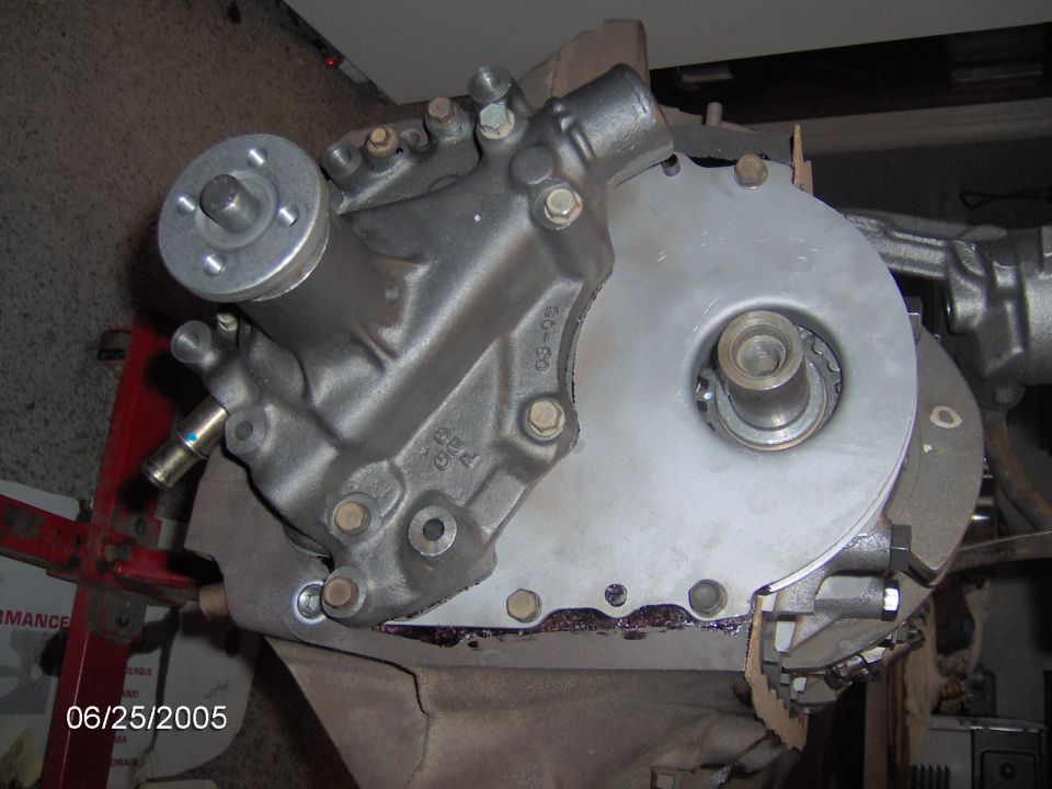 Engine water pump and timing cover assembly