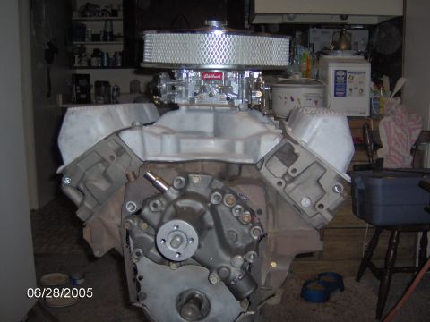 1978 Ford Bronco - A V8 engine assembly an Edelbrock carburetor and chrome air cleaner is shown, likely part of a rebuild project.