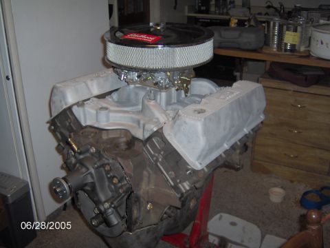 1978 Ford Bronco - Engine assembly on a stand, an Edelbrock air cleaner and aluminum valve covers.