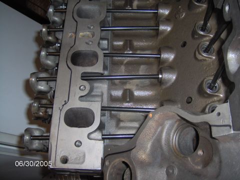 1978 Ford Bronco - Close-up view of an engine block, showing the intake manifold gasket and pushrods.