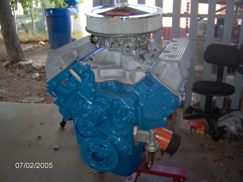 1978 Ford Bronco - A blue V8 engine with a chrome air cleaner and fuel pump is shown, possibly for a rebuild project.
