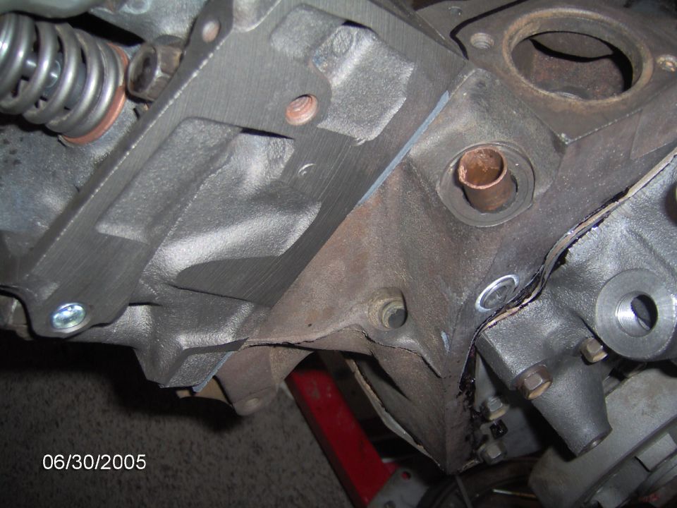 Engine block with copper pipe fitting and spring assembly