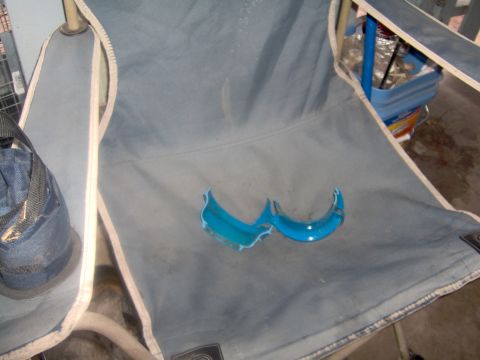 1978 Ford Bronco - Broken blue plastic fragments are visible on a gray fabric chair.