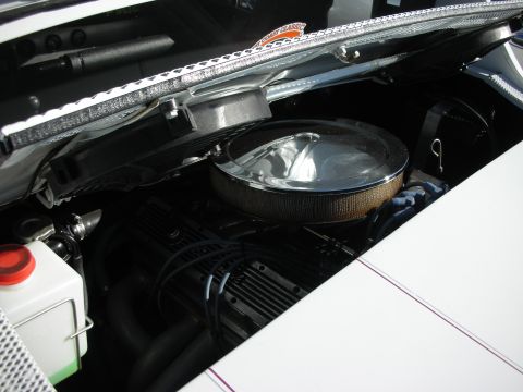 1992 Ford Crown Victoria - Close-up view of a V8 engine bay a chrome air cleaner and exhaust headers.