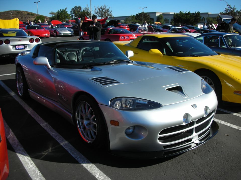 Silver Dodge Viper sports car parked in a lot, front quarter view