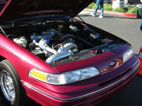 1992 Ford Crown Victoria - Customized 1992 Ford Crown Victoria engine bay with a prominent supercharger setup.