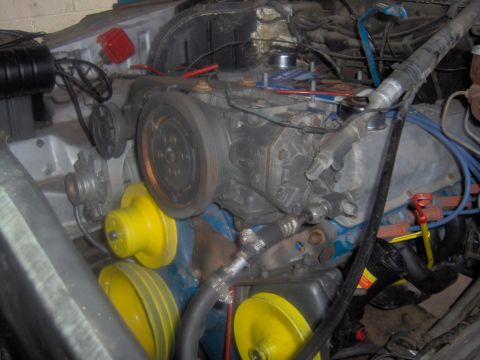 1978 Ford Bronco - Close-up of an engine bay, focusing on the belt and pulley system.