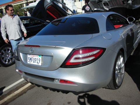 1992 Ford Crown Victoria - A silver Mercedes-Benz SLR McLaren is shown from the rear, with its distinctive taillights and California license plate visible.