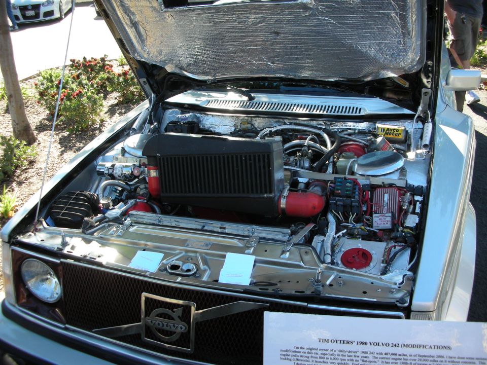 Engine bay of a Volvo 242 with aftermarket turbo and intercooler