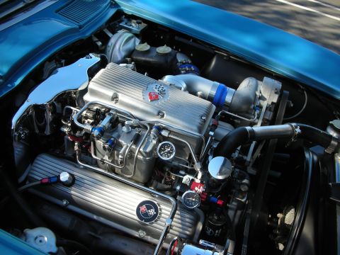 1992 Ford Crown Victoria - Detailed view of a custom engine bay, chrome components and Corvette branding.