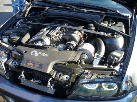1991 Ford Probe - The engine bay features a turbocharger and aftermarket cooling components, with "Active Automotive" branding visible.