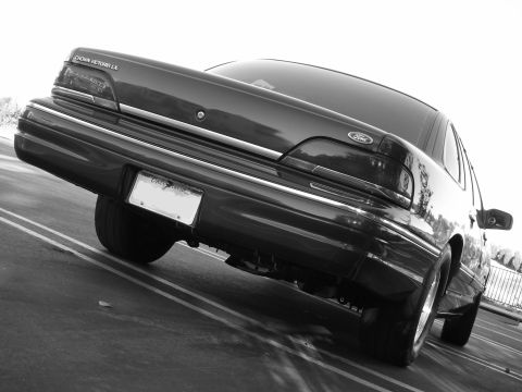1992 Ford Crown Victoria - Rear view of a 1992 Ford Crown Victoria LX, showing its distinctive taillights and chrome trim.
