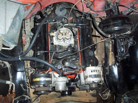1972 Chevrolet C/K Pickup - Close-up view of the engine compartment in a 1972 Chevrolet C/K Pickup, showing the V8 engine and its components.