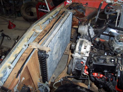 1972 Chevrolet C/K Pickup - Close-up view of the engine bay, focusing on the radiator and alternator assembly.