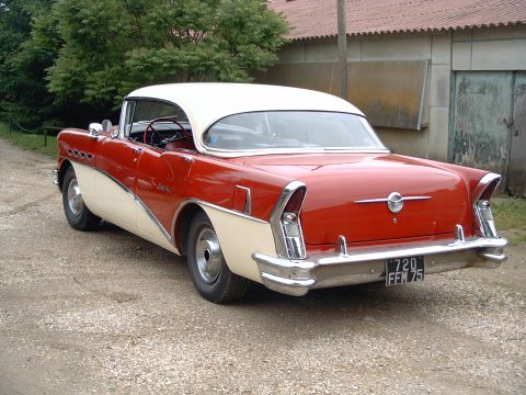 1991 Ford Crown Victoria - Rear view of a two-tone 1956 Buick Century parked outdoors.