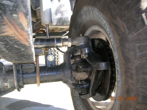 1985 Ford Bronco - This photo shows the suspension and tire of an off-road vehicle, not a specific model year.