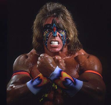 1991 Ford Bronco - A wrestler with colorful face paint and wristbands poses with clenched fists.