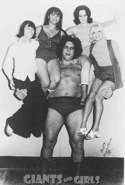 1991 Ford Bronco - Andre the Giant poses with four women, with the text "GIANTS AND GIRLS" visible at the bottom.