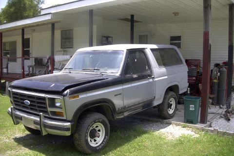 1984 Ford Bronco - This Ford Bronco is parked outside a residence with a covered porch and appears to be undergoing some work.