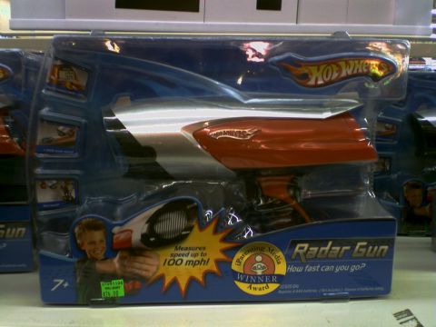 2001 Ford Crown Victoria - A Hot Wheels Radar Gun toy is displayed in its retail packaging.
