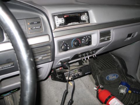 1995 Ford Bronco - Interior view of a 1995 Ford Bronco, a CB radio and fire extinguisher on the passenger side.