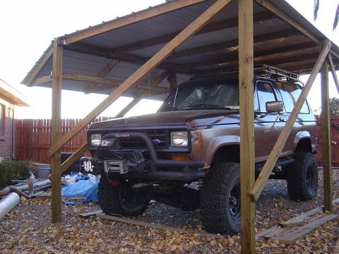 1986 Ford Bronco II - This Ford Bronco II, likely from the early to mid-1980s, is equipped with off-road tires and a winch.