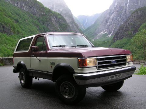 1989 Ford Bronco - 1989 Ford Bronco in a scenic mountain landscape.