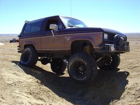 1986 Ford Bronco II - This lifted Ford Bronco II is ready for off-road adventures, with its tires and suspension clearly visible.
