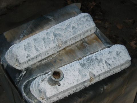 1991 Ford Bronco - Pair of engine valve covers with white residue, possibly needing cleaning or restoration.